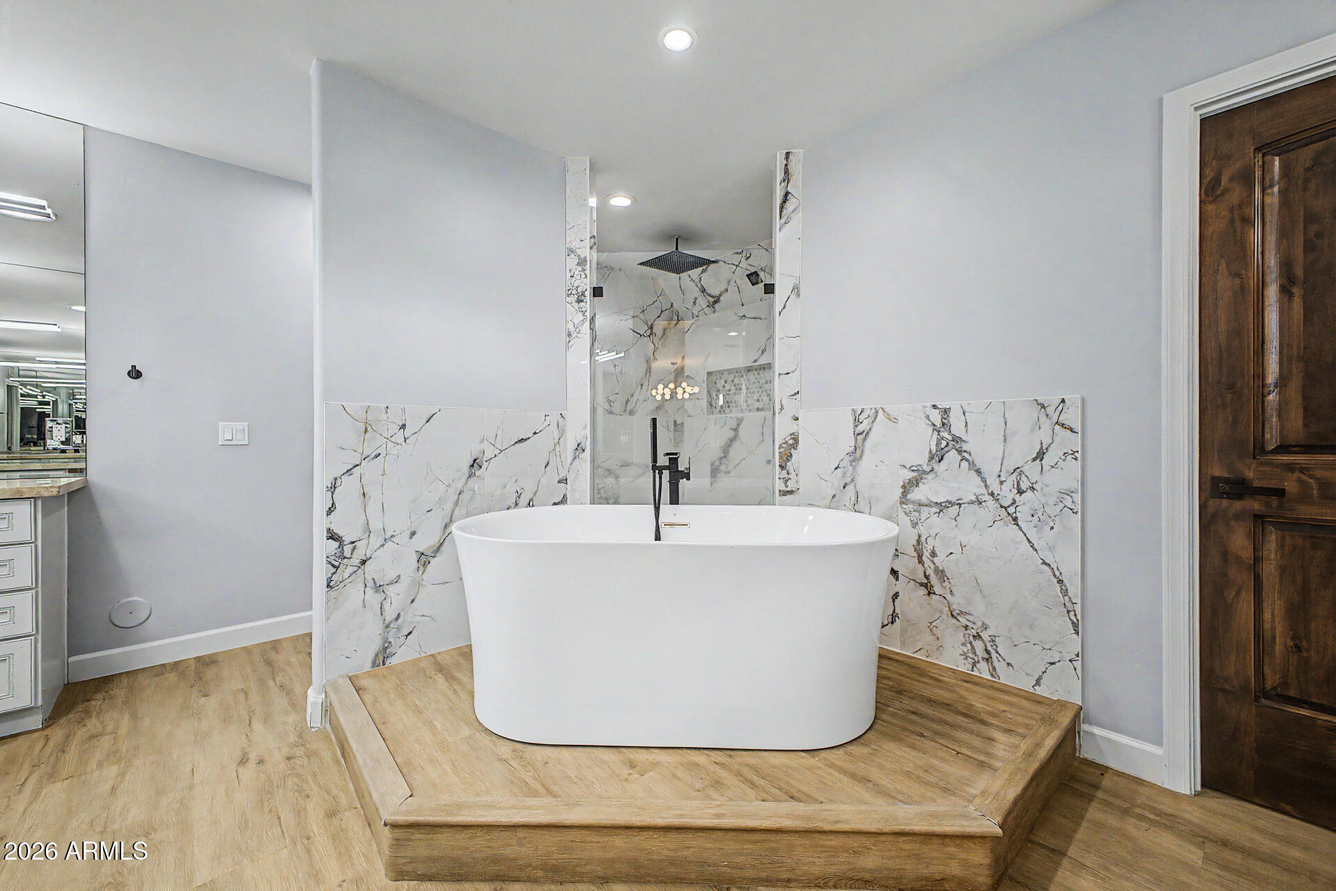 2311 East Colter Street Phoenix, AZ 85016 - Photo 21 of 93 a white bath tub sitting in a bathroom