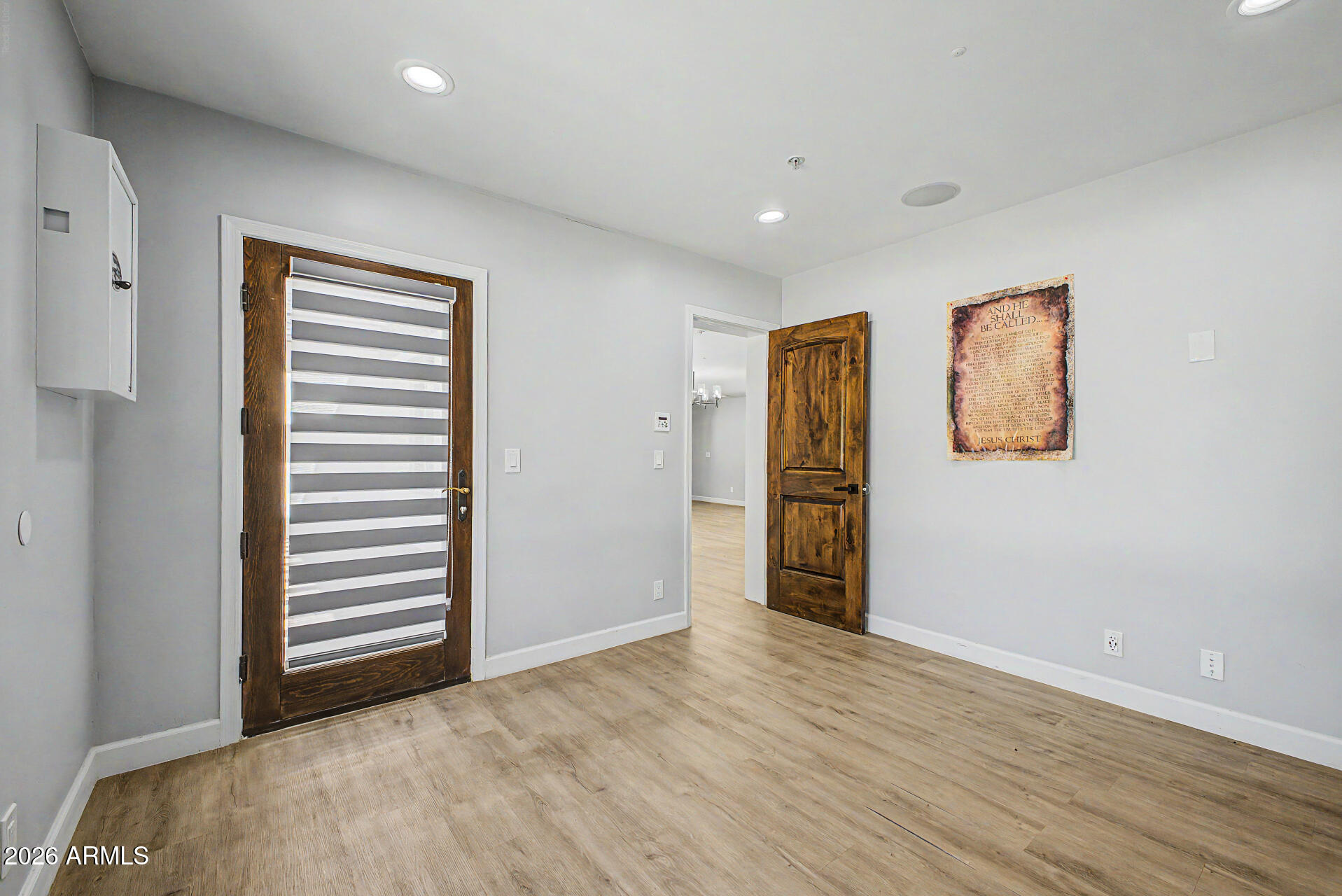 2311 East Colter Street Phoenix, AZ 85016 - Photo 33 of 93 a view of an empty room with wooden floor