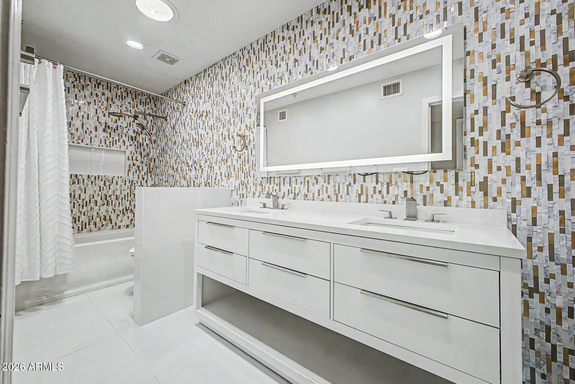 2311 East Colter Street Phoenix, AZ 85016 - Photo 40 of 93 a bathroom with a sink and a mirror