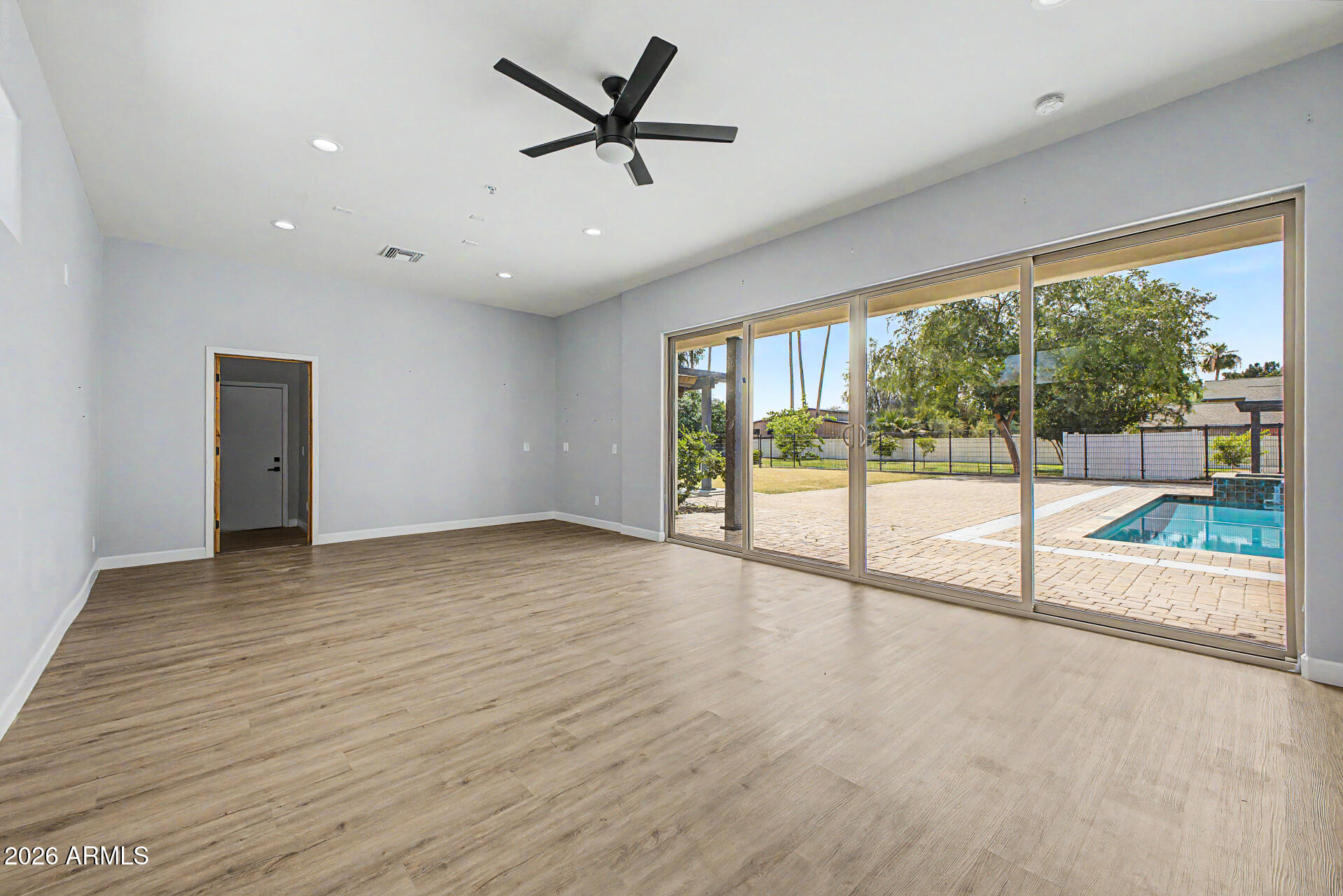2311 East Colter Street Phoenix, AZ 85016 - Photo 45 of 93 a view of an empty room with a window and a ceiling fan