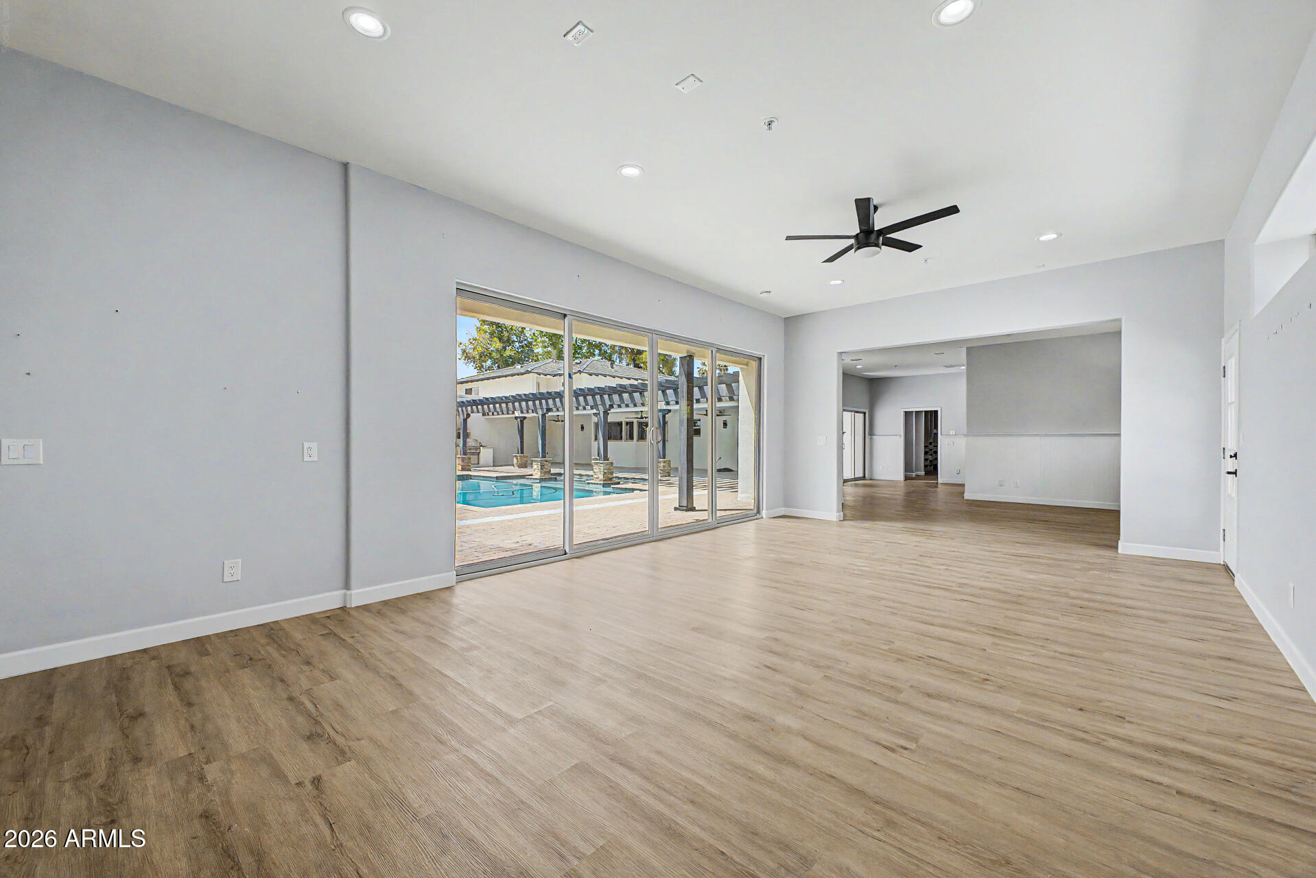 2311 East Colter Street Phoenix, AZ 85016 - Photo 46 of 93 a view of an empty room with a window and a kitchen