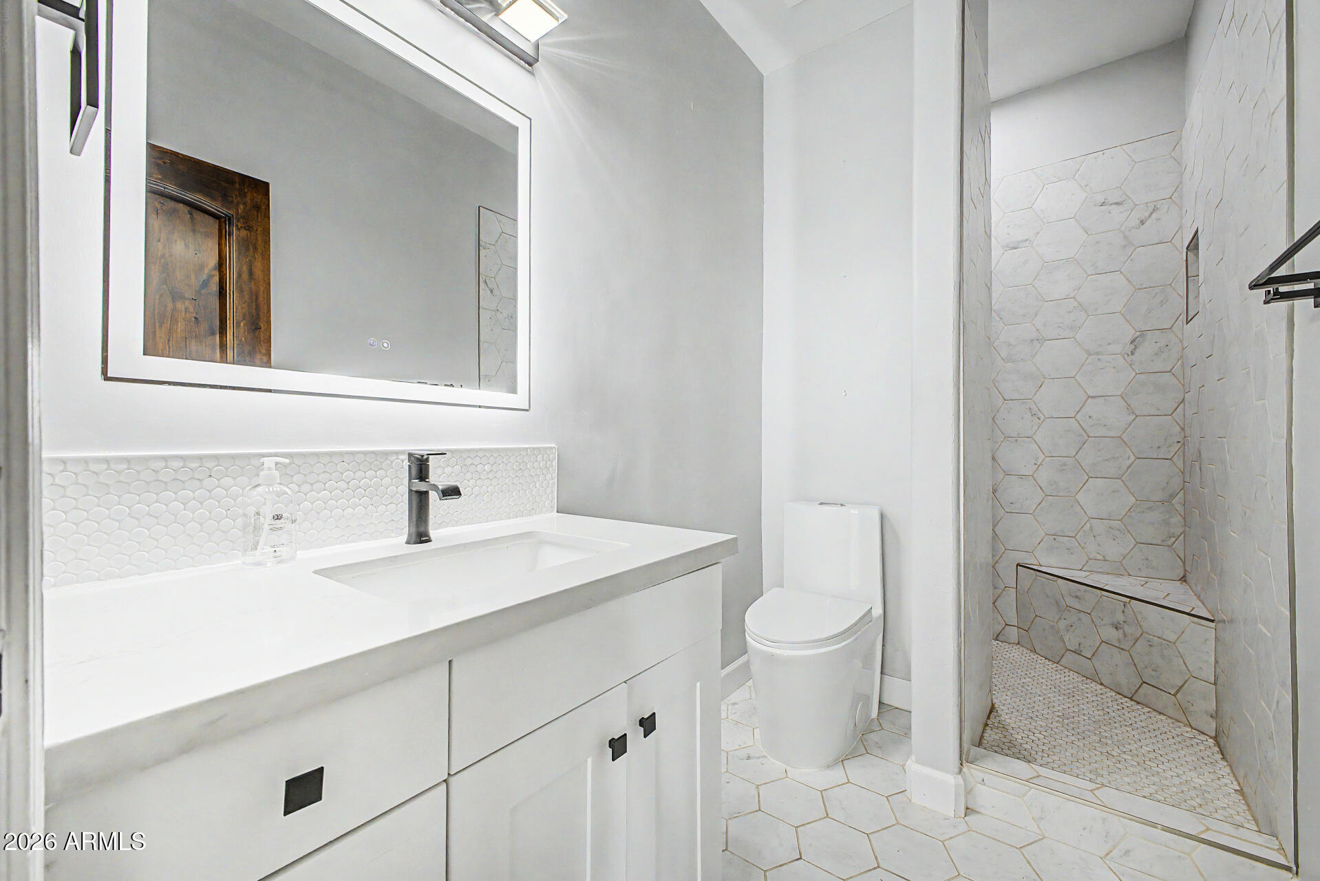 2311 East Colter Street Phoenix, AZ 85016 - Photo 47 of 93 a bathroom with a sink a toilet and a mirror