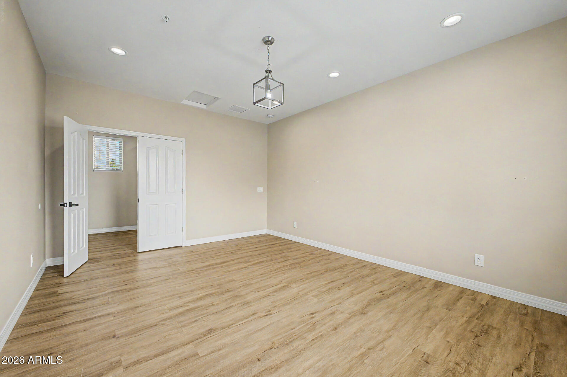 2311 East Colter Street Phoenix, AZ 85016 - Photo 60 of 93 wooden floor in an empty room with a window