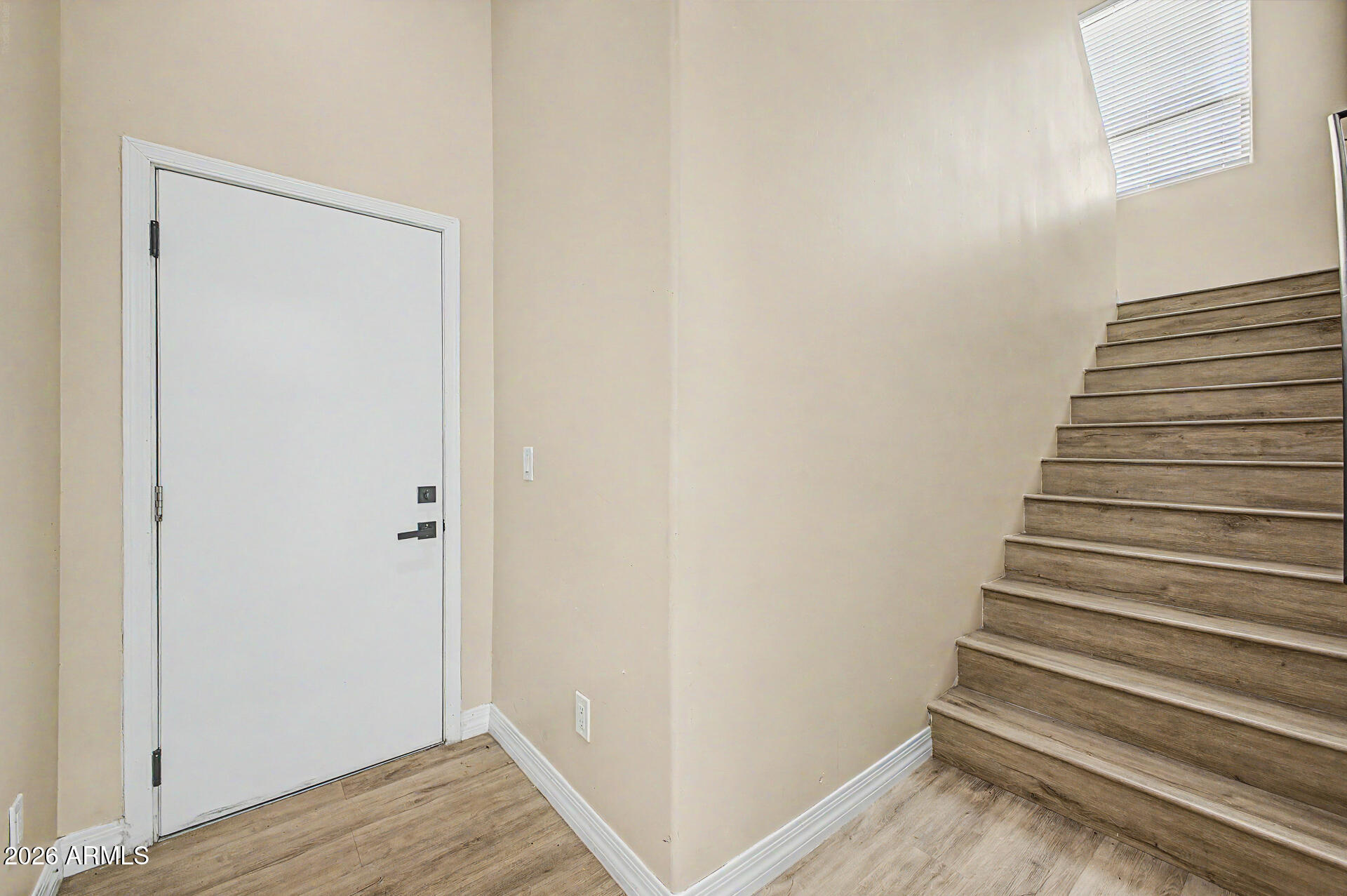 2311 East Colter Street Phoenix, AZ 85016 - Photo 61 of 93 a view of a hallway with wooden floor and entryway