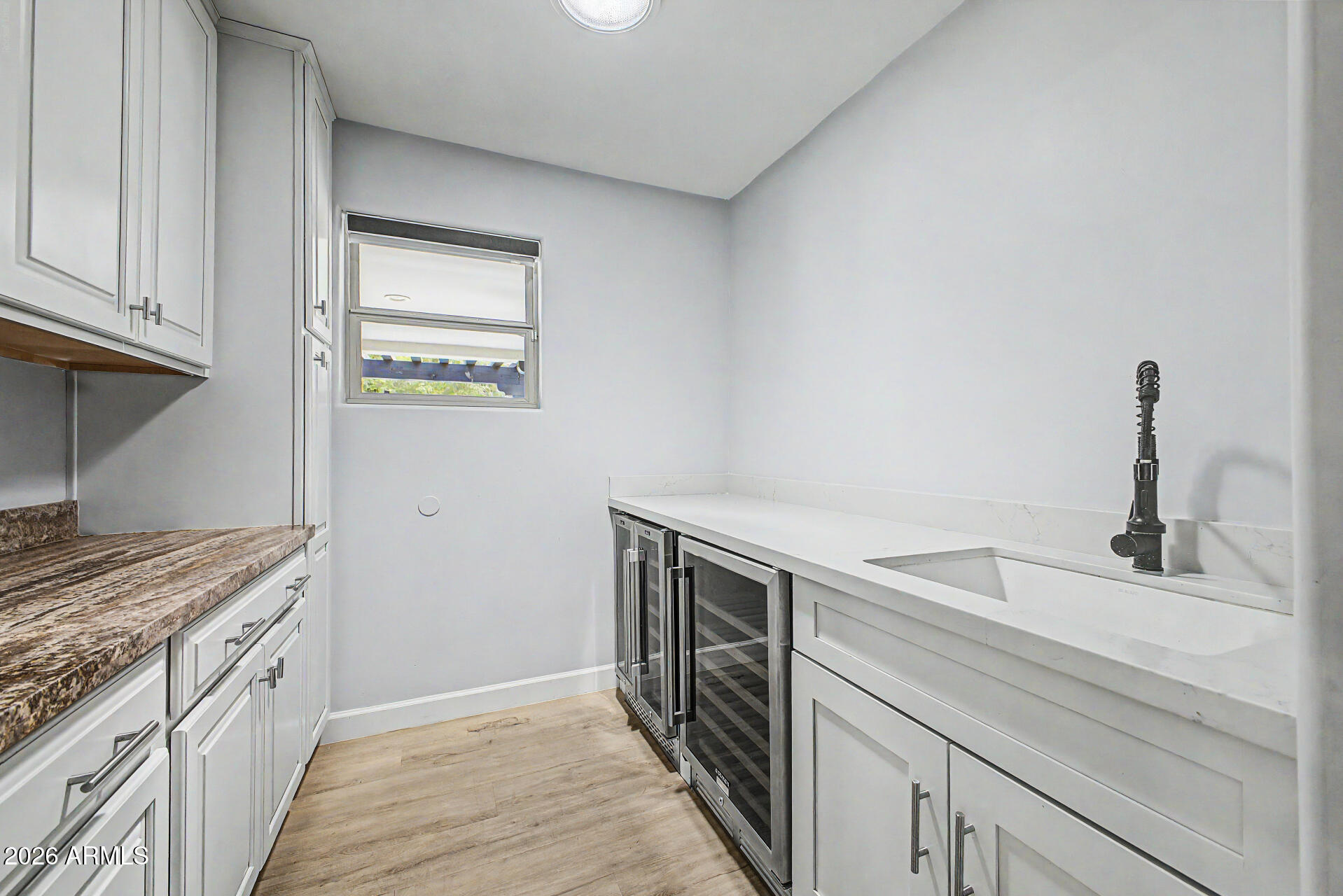 2311 East Colter Street Phoenix, AZ 85016 - Photo 63 of 93 a kitchen with a sink and a stove top oven