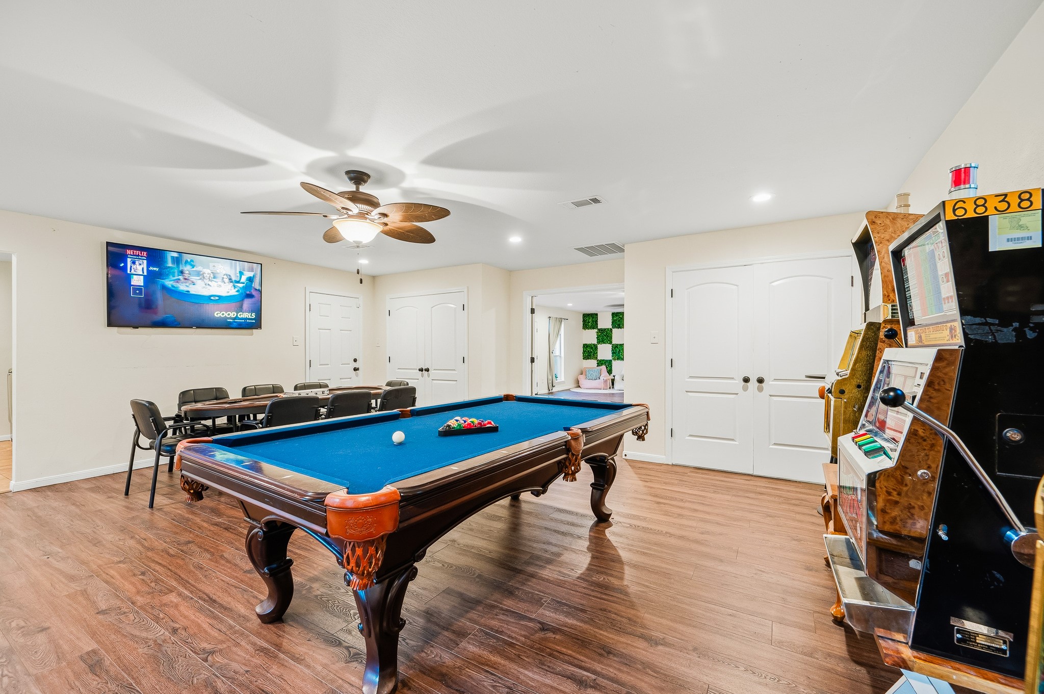 16811 Waycreek Road Houston, TX 77068 - Photo 46 of 50 a room with wooden floor pool table and windows