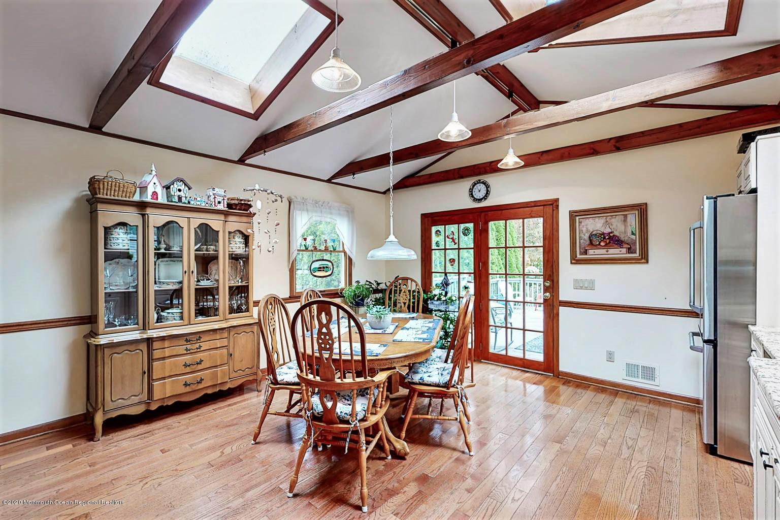54 Ridge Avenue Manasquan, NJ 08736 - Photo 15 of 42 a dining room with furniture window and wooden floor