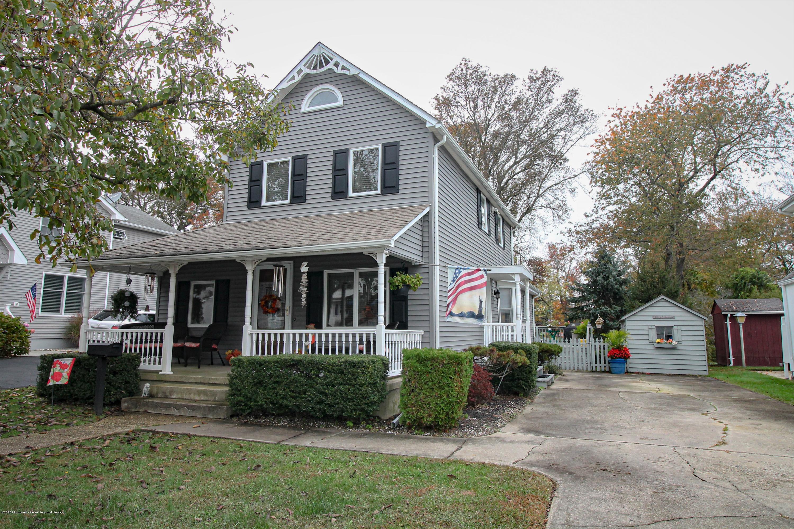 54 Ridge Avenue Manasquan, NJ 08736 - Photo 3 of 42 a front view of a house with a yard and garage