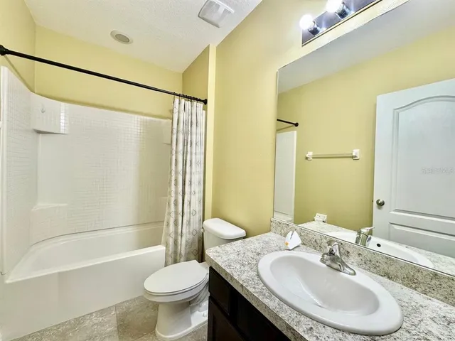 an empty room with a fan