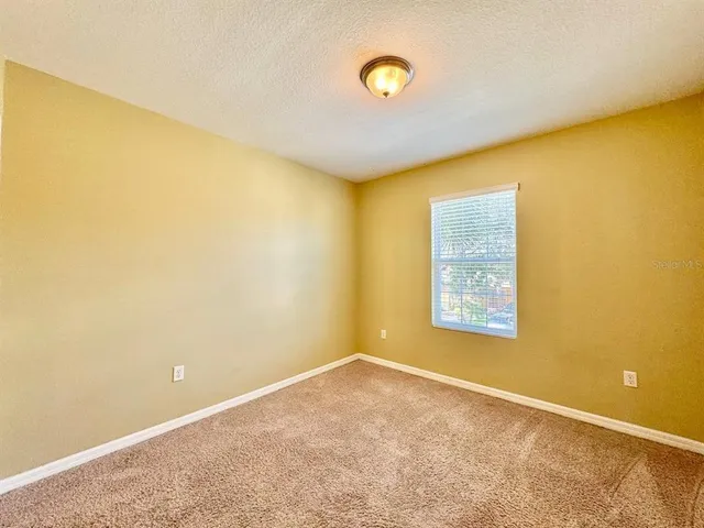 a view of a big room with windows