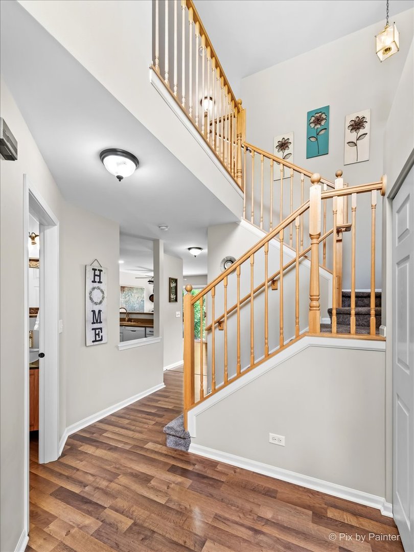 10884 Cape Cod Lane Huntley, IL 60142 - Photo 3 of 22 a view of entryway and hall with wooden floor
