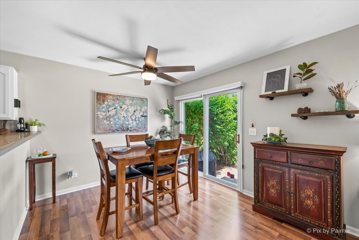 10884 Cape Cod Lane Huntley, IL 60142 - Photo 8 of 22 a view of a dining room with furniture window and wooden floor