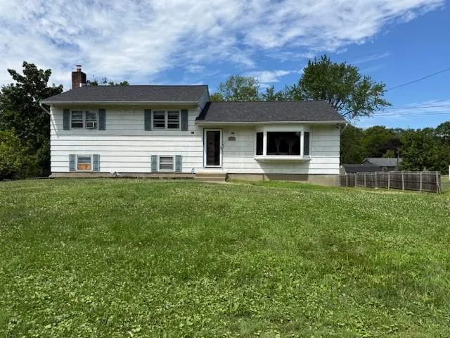 a house view with a garden space