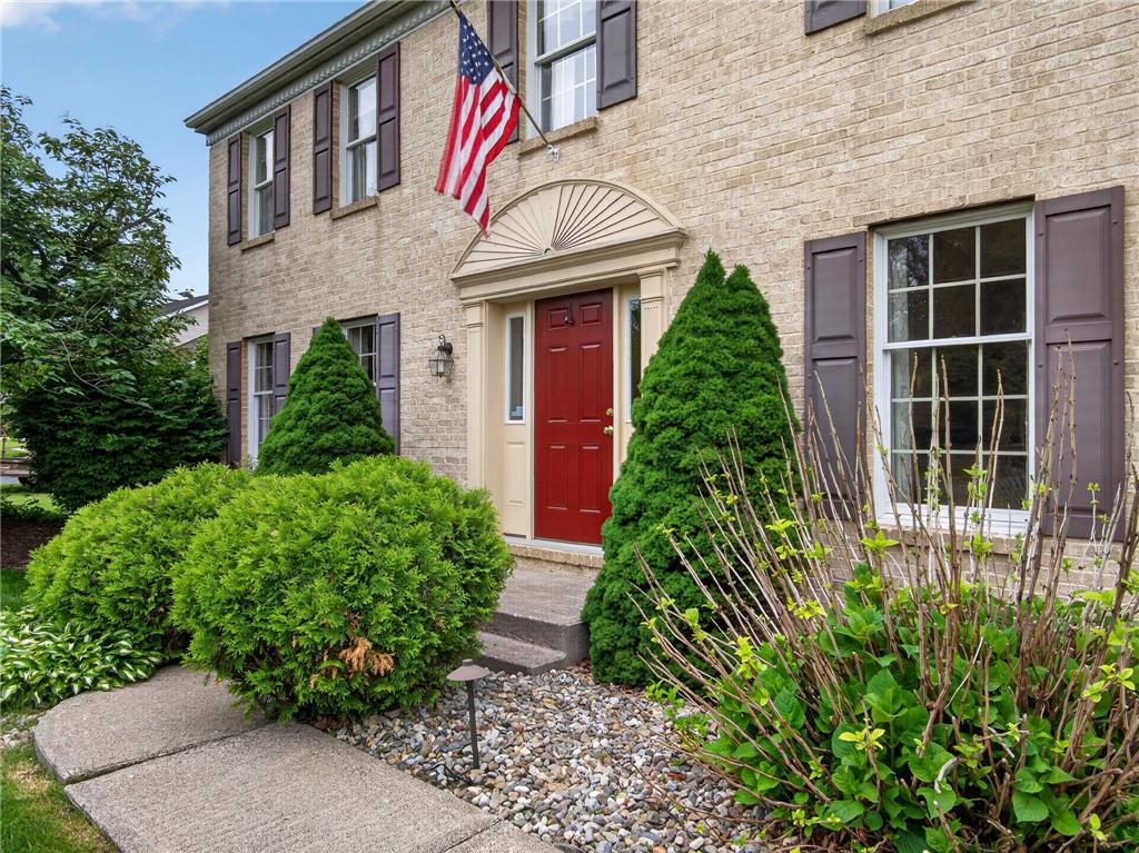 853 Lahr Road Nazareth, PA 18064 - Photo 3 of 29 A classic brick exterior offers timeless curb appeal with welcoming red entry and manicured landscaping.