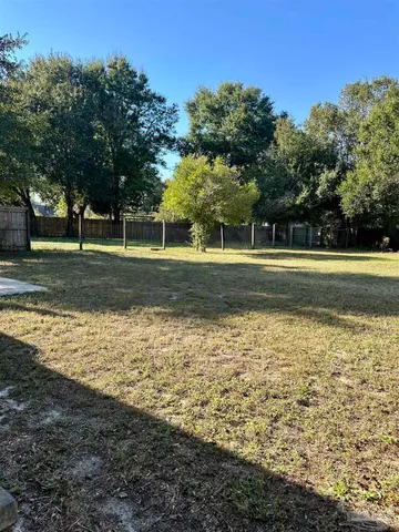 a view of a yard with an trees