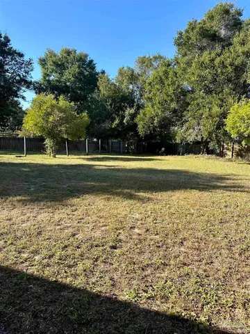 a view of a lake with a big yard