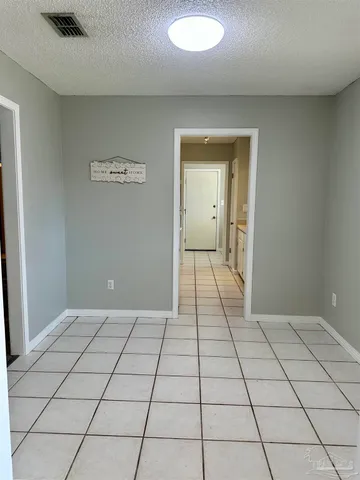 a view of a livingroom with an empty space and a sink