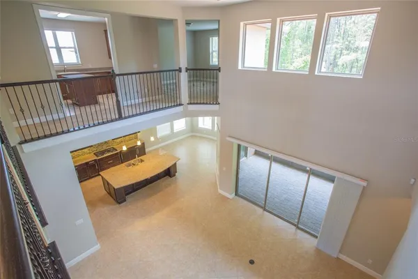 a view of a kitchen and kitchen with a large window