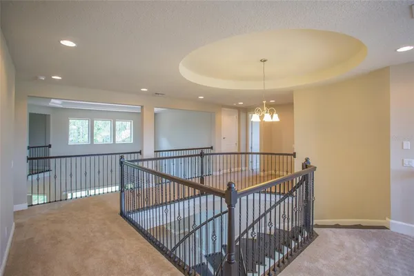 a kitchen with stainless steel appliances granite countertop wooden cabinets a sink and dishwasher a oven with wooden floors
