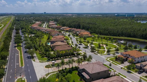 an aerial view of a house with a big yard