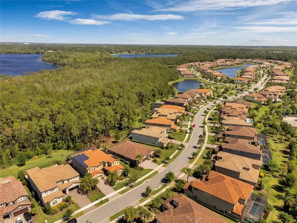 an aerial view of residential building and lake