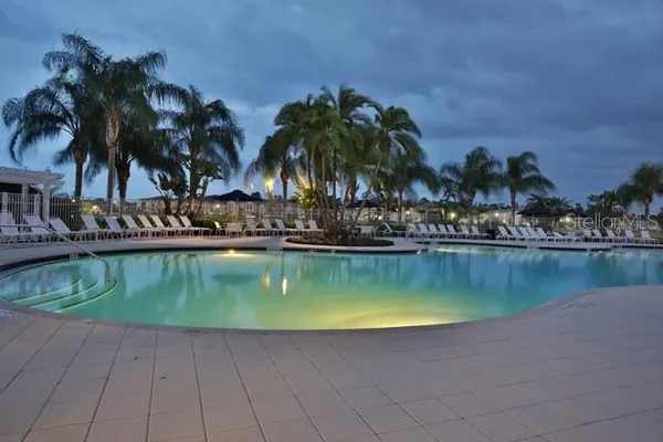 a view of roof deck with wooden fence and floor
