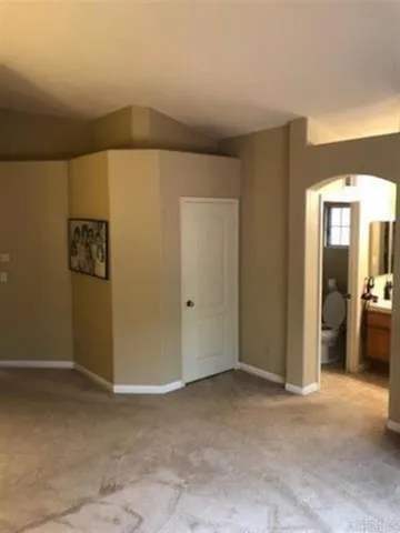 a view of a hallway with bathroom