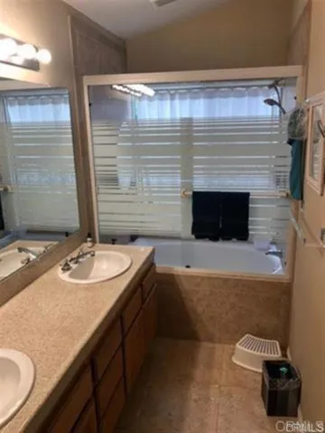 a room with a window and a wooden floor