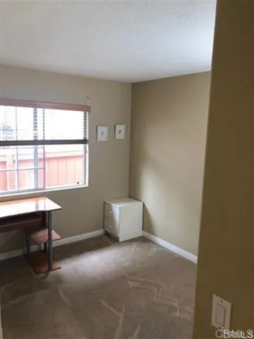 a swimming pool with outdoor seating and yard