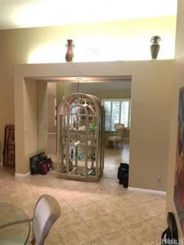 a view of a entryway door with livingroom