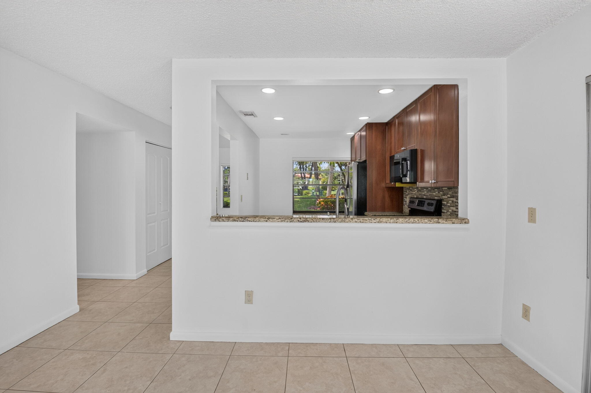 9264 Vista Del Lago, Unit A Boca Raton, FL 33428 - Photo 10 of 48 View of kitchen from Living Room