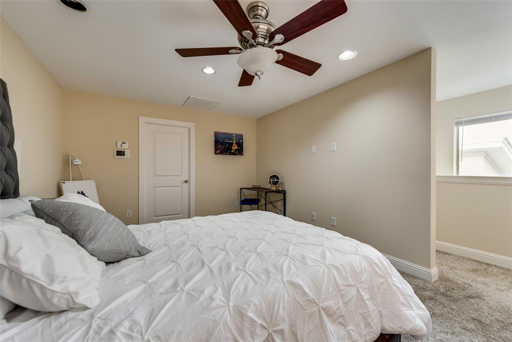 4973 Thunder Road, Unit B Dallas, TX 75244 - Photo 16 of 22 a bedroom with a bed and a window