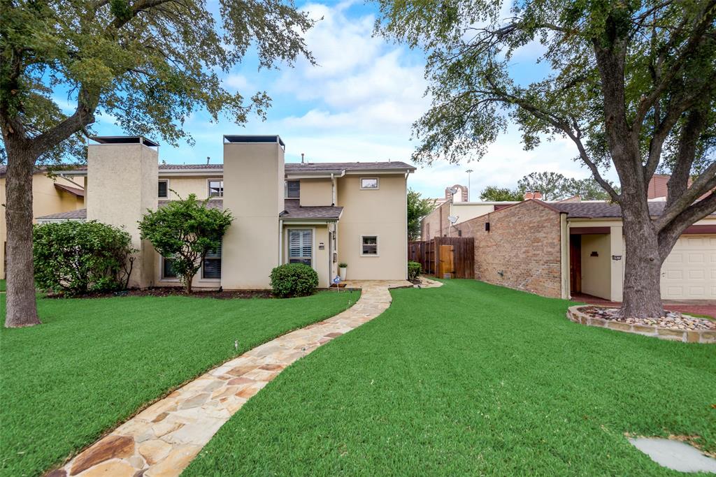 4973 Thunder Road, Unit B Dallas, TX 75244 - Photo 22 of 22 a view of a backyard with a large tree