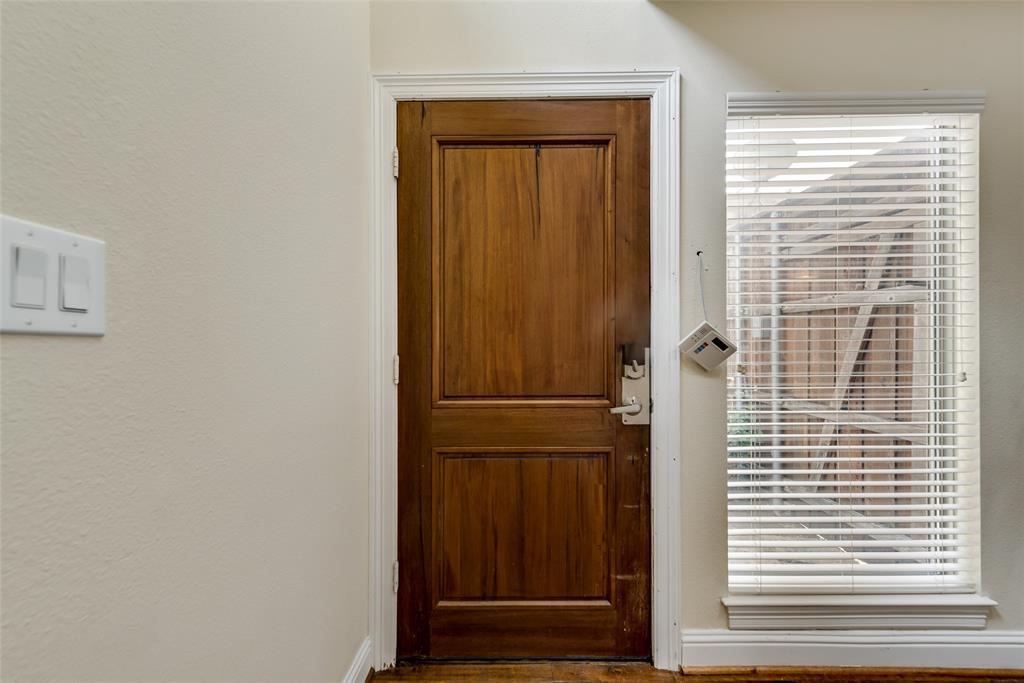 4973 Thunder Road, Unit B Dallas, TX 75244 - Photo 4 of 22 a view of wooden door