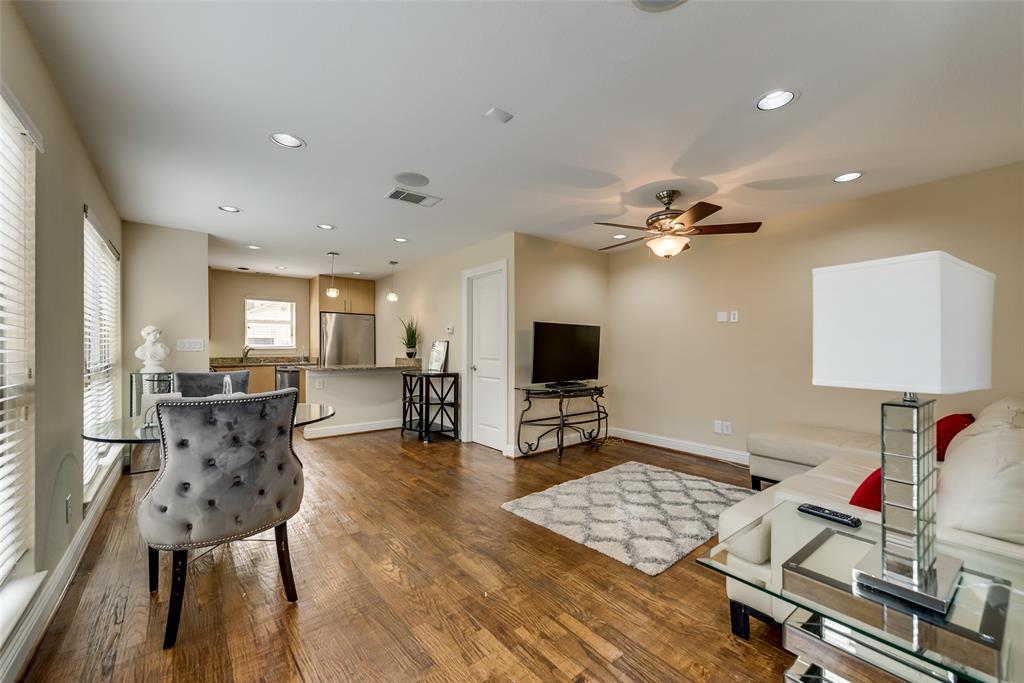 4973 Thunder Road, Unit B Dallas, TX 75244 - Photo 5 of 22 a living room with furniture and a flat screen tv