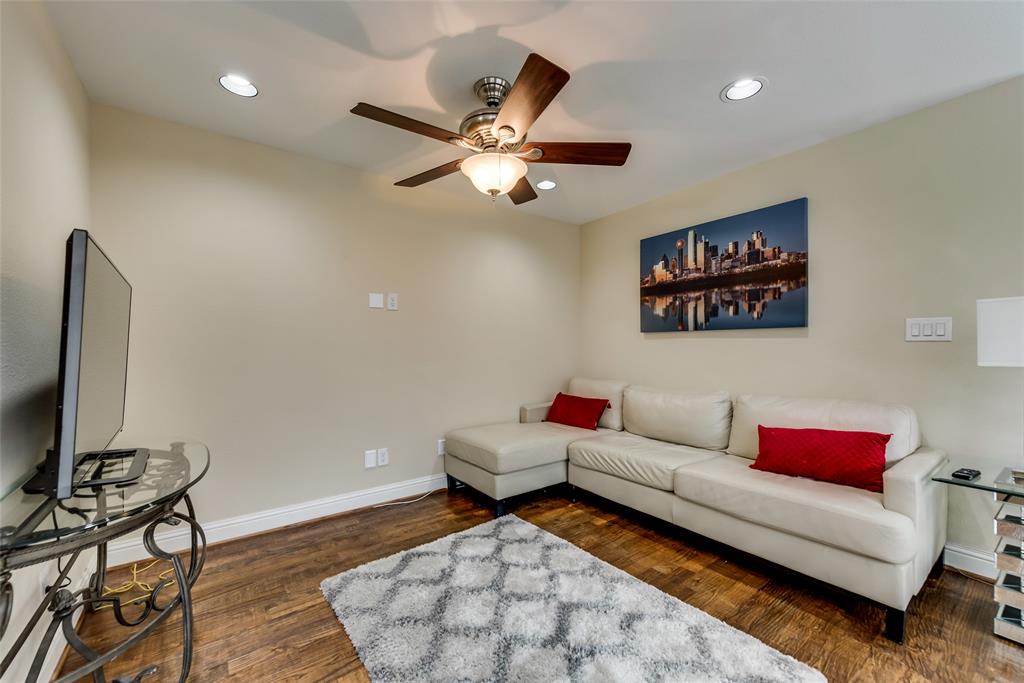 4973 Thunder Road, Unit B Dallas, TX 75244 - Photo 8 of 22 a living room with furniture and a flat screen tv