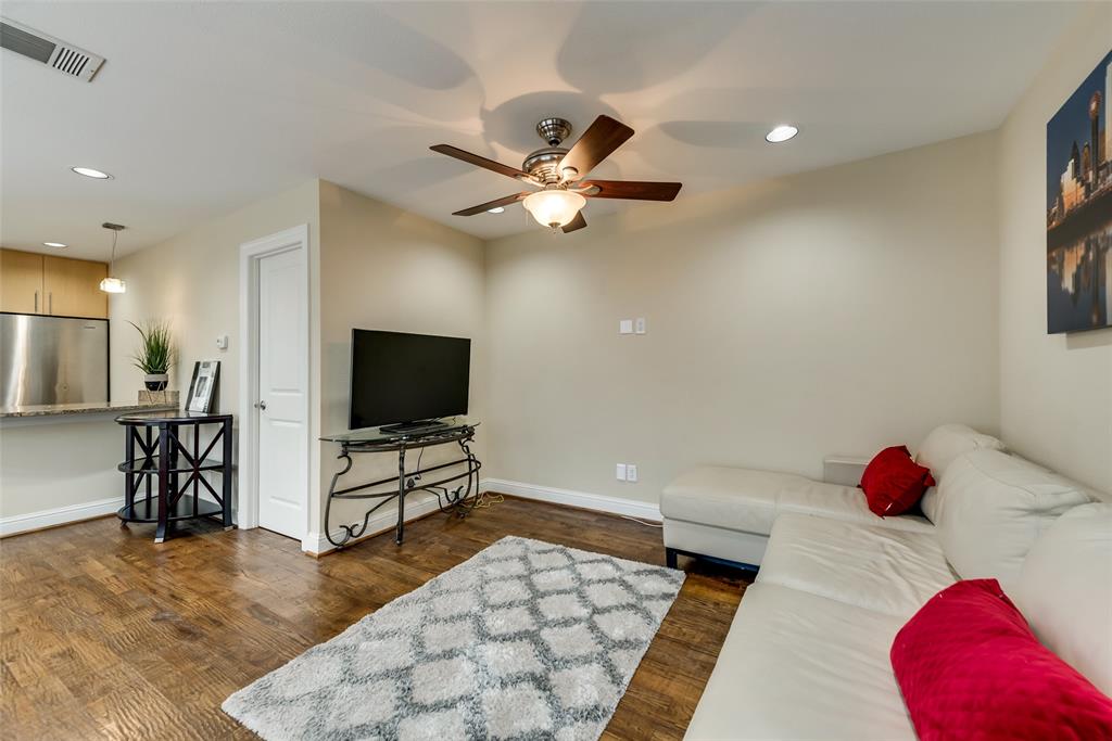 4973 Thunder Road, Unit B Dallas, TX 75244 - Photo 9 of 22 a bedroom with a bed and a flat screen tv
