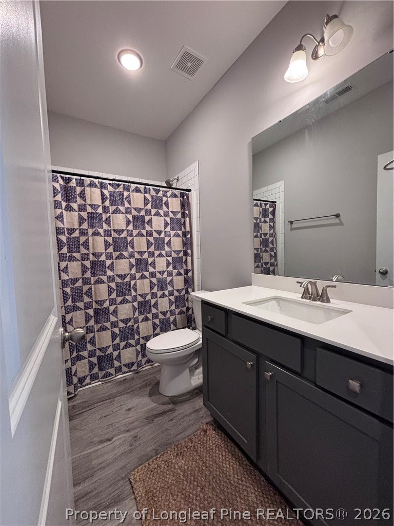 7720 Rufus Johnson Road Fayetteville, NC 28306 - Photo 35 of 50 a bathroom with a sink toilet and shower