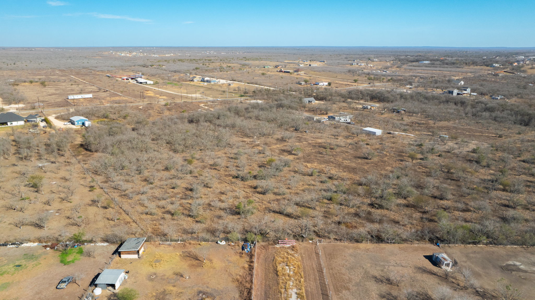 3991 Barth Road Lockhart, TX 78644 - Photo 21 of 27 Aerial view of property and surrounding area featuring rural landscape and a desert landscape