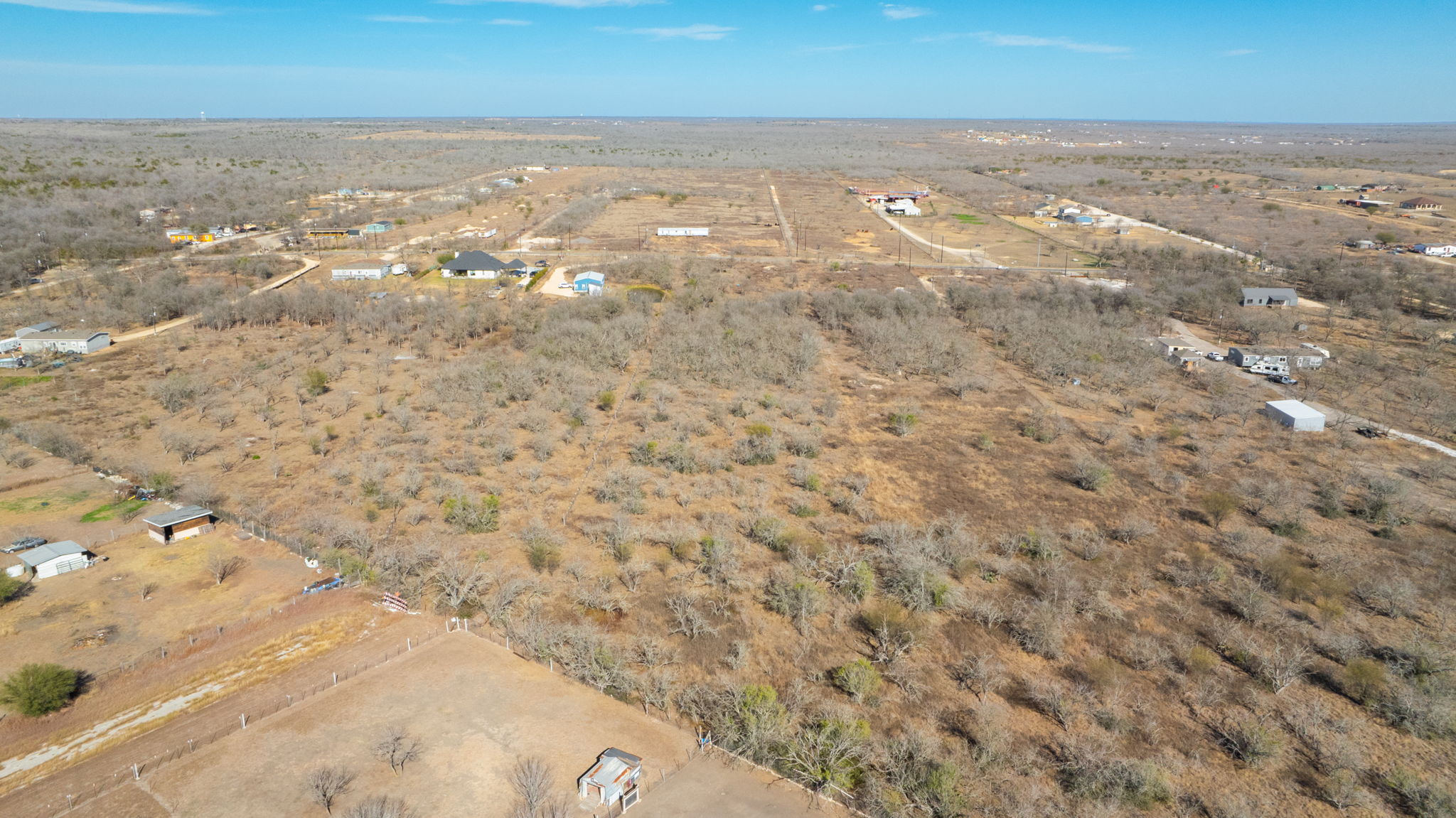 3991 Barth Road Lockhart, TX 78644 - Photo 22 of 27 Aerial view of property and surrounding area with rural landscape and a desert landscape