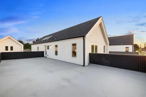 a view of house with yard