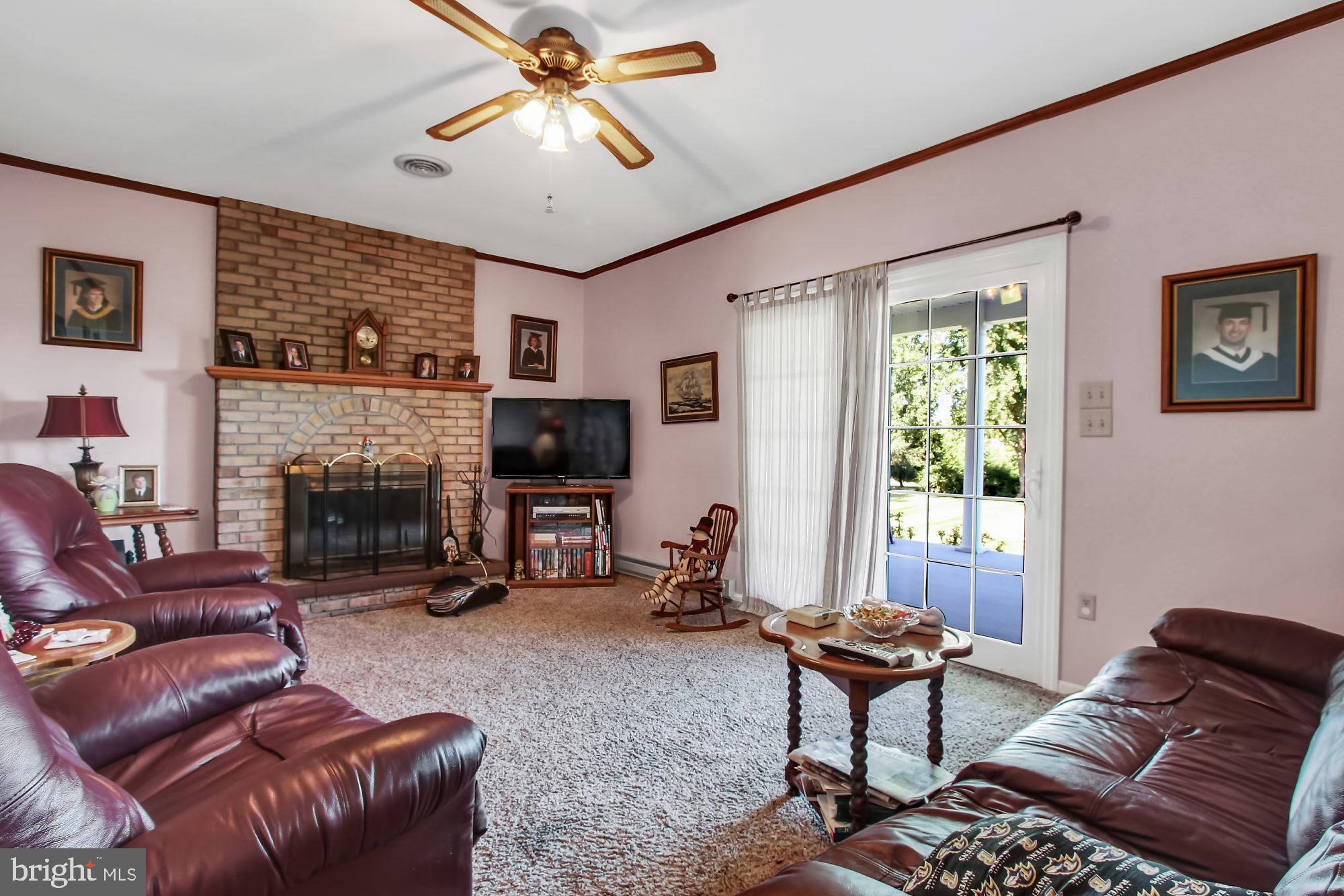 22364 Durberry Road Smithsburg, MD 21783 - Photo 13 of 37 Family Room w/ ceiling fan and fireplace