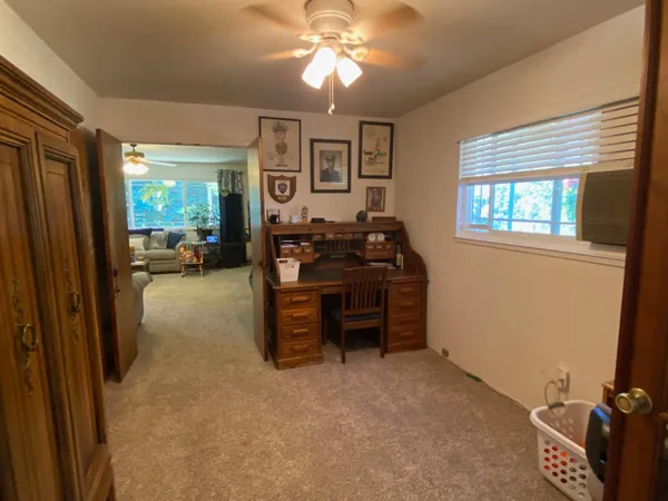 a view of a livingroom with furniture and window