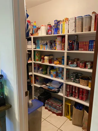 a room with a book shelf and a book shelf