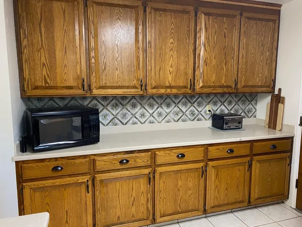a close view of sink and cabinets