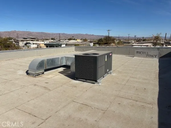 a kitchen with a stove sink and cabinets