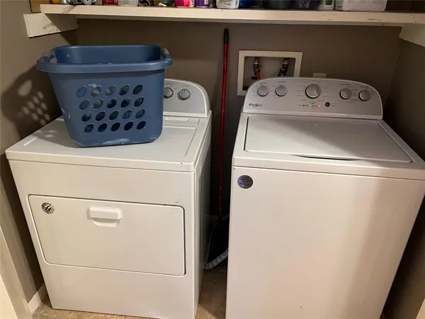 a utility room with dryer and washer