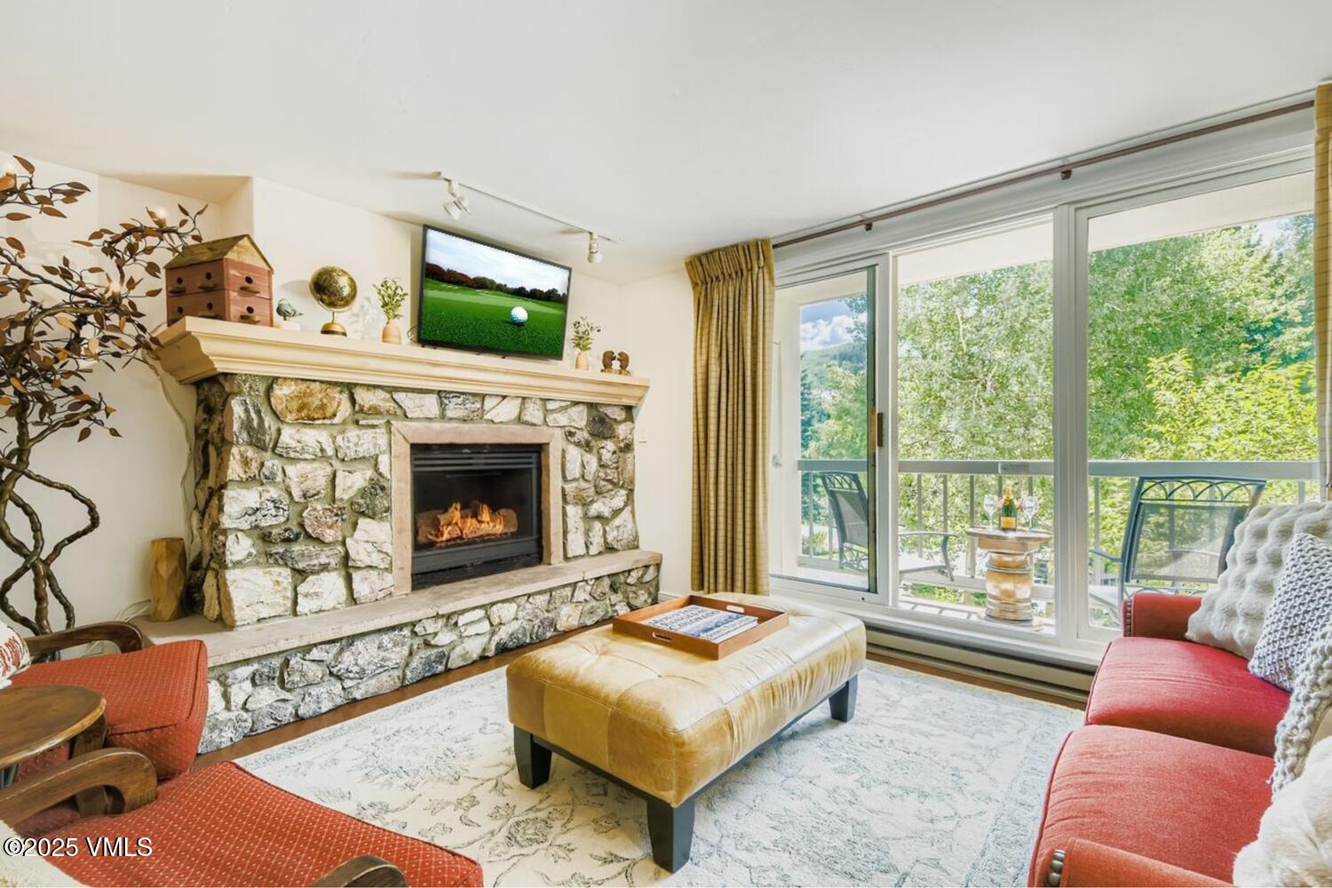 1120 Village Road, Unit 204 Beaver Creek, CO 81620 - Photo 1 of 29 a living room with furniture and a fireplace