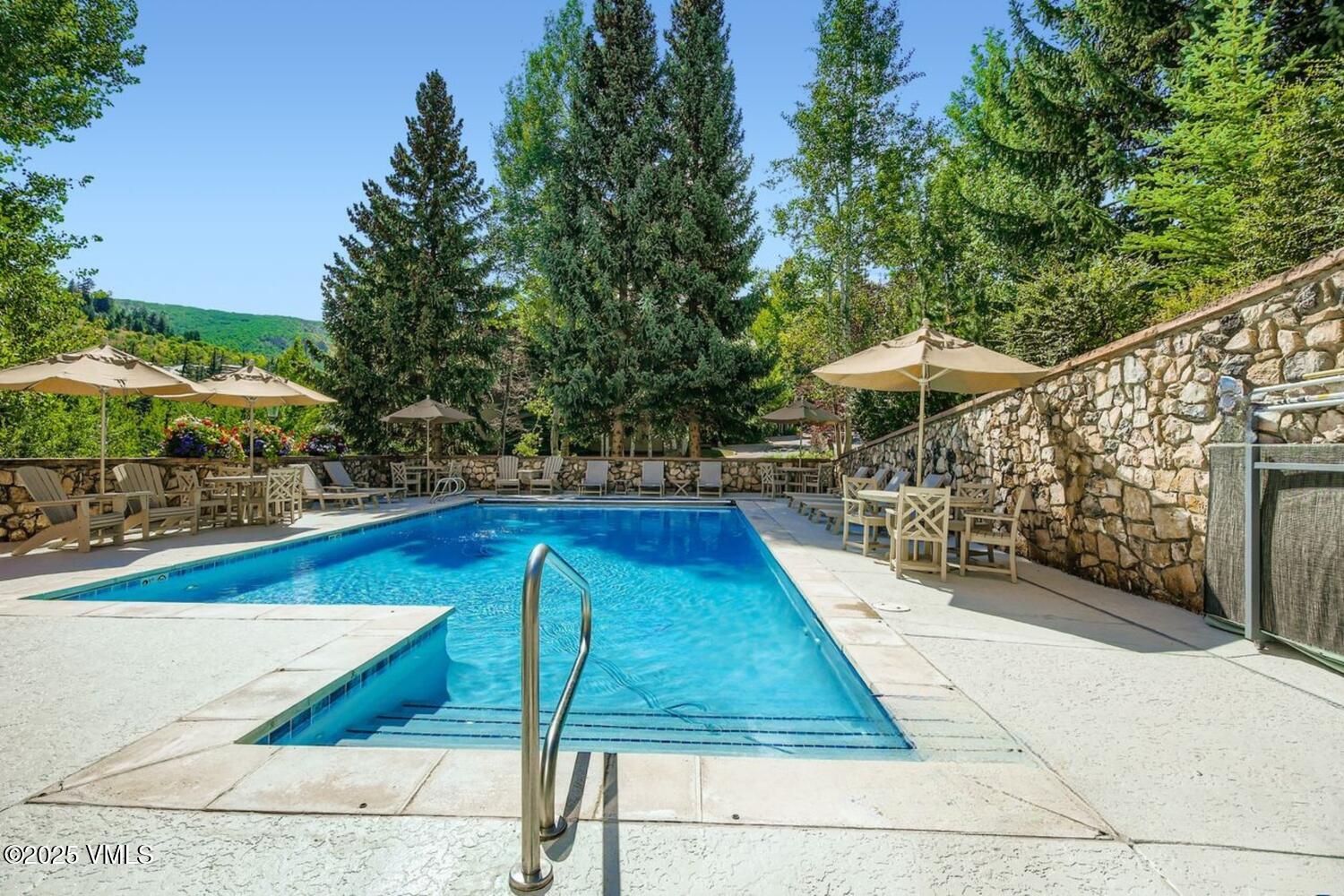 1120 Village Road, Unit 204 Beaver Creek, CO 81620 - Photo 20 of 29 a view of swimming pool with chairs