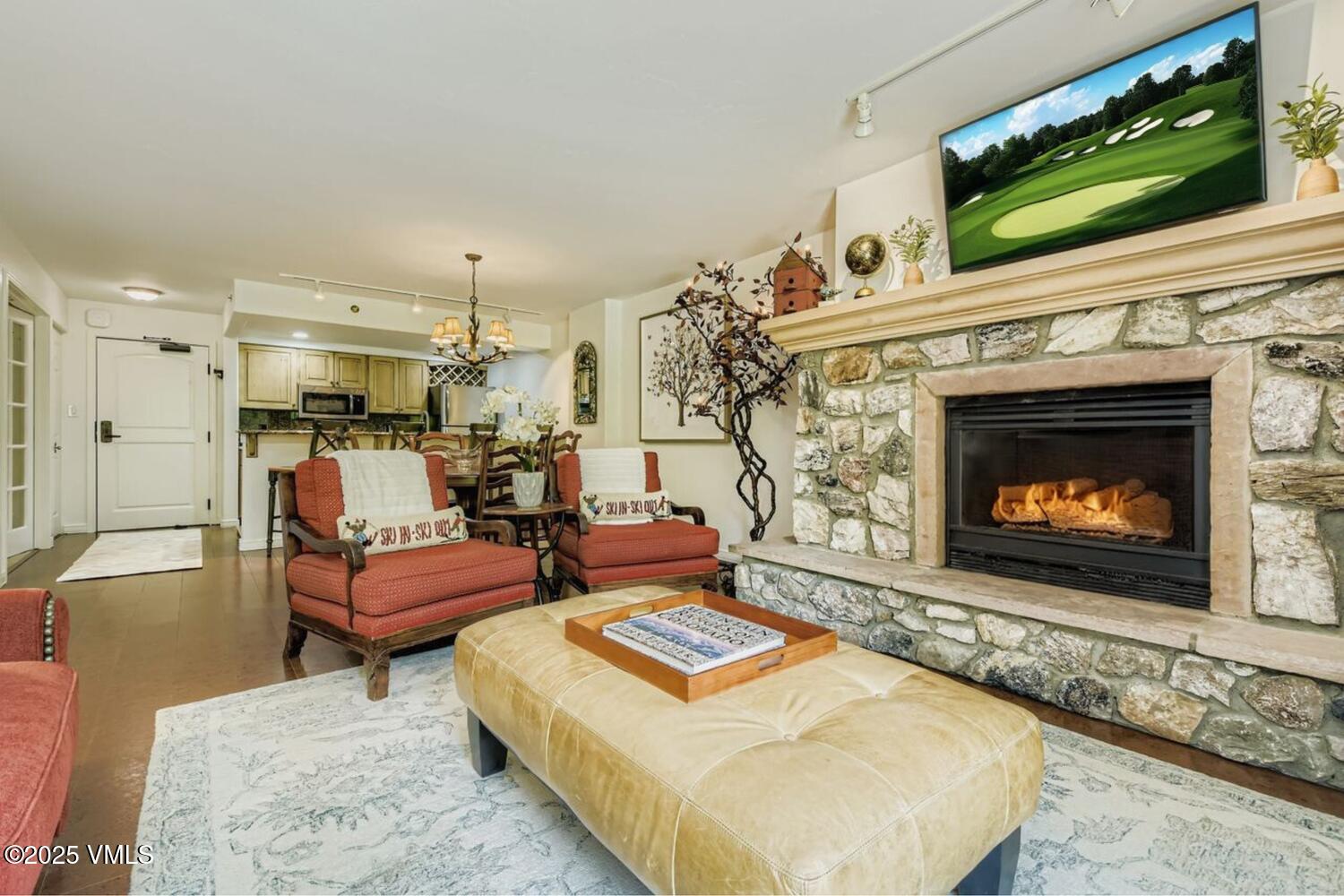 1120 Village Road, Unit 204 Beaver Creek, CO 81620 - Photo 2 of 29 a living room with furniture and a fireplace